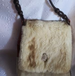 Handmade leather and fur arm bag